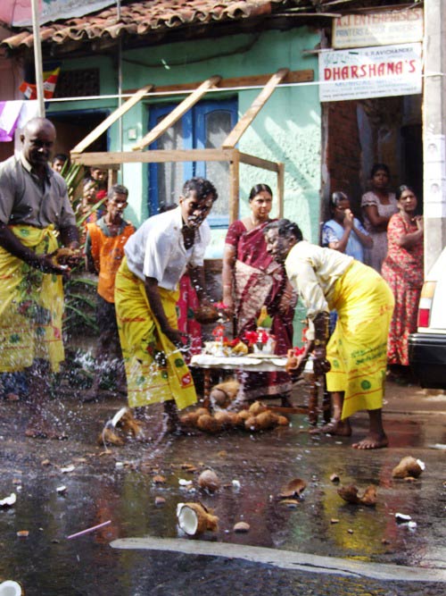 Coconuts are continuously smashed by the devotees.