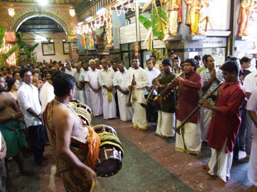 Devotional songs dedicated to God Sivasubramaniya Swamy are being played by the musicians.